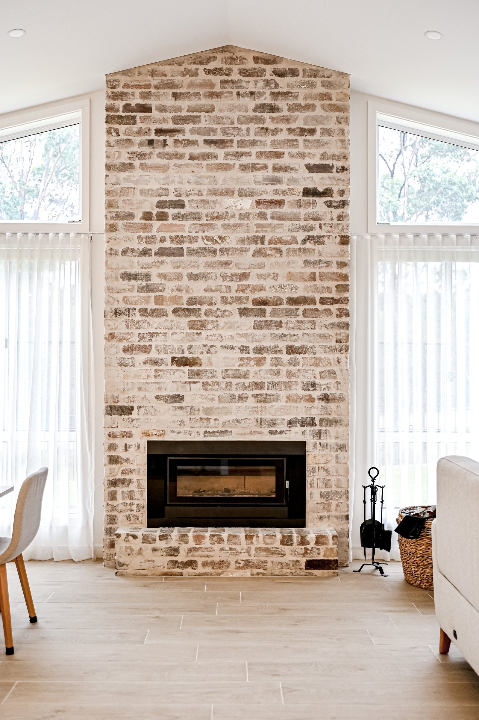 Living room fireplace by Impact Homes Co.