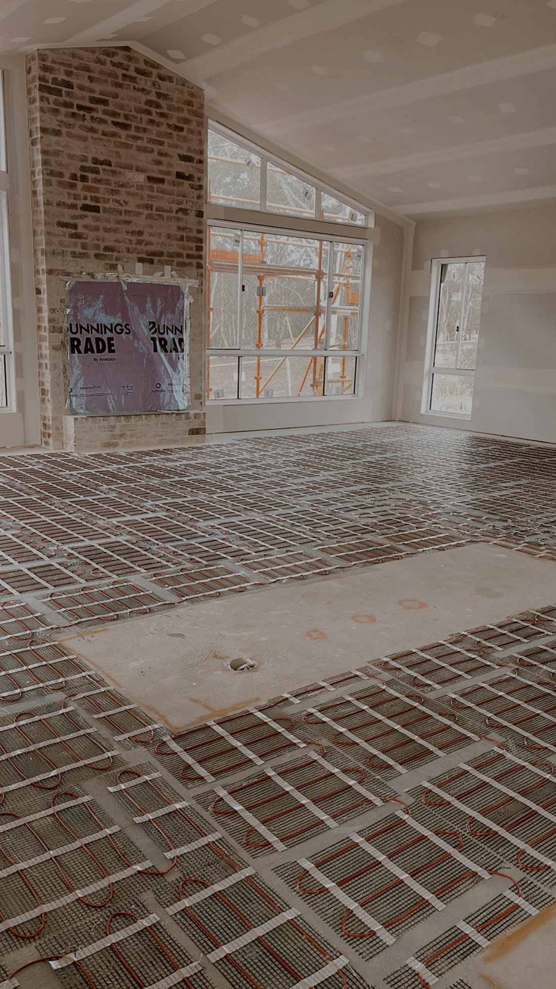 In-slab floor heating installed ahead of tiling